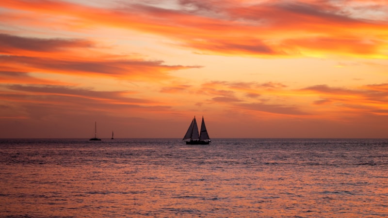 Sailboat on the ocean at sunset